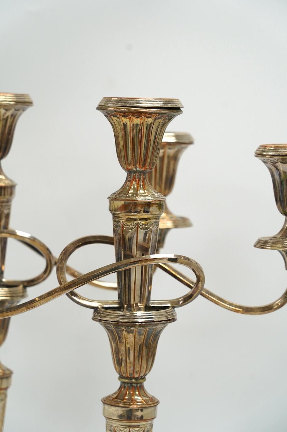 A pair of 19th century Old Sheffield plate three light, two branch candelabra, 44cm high. Condition - fair to good